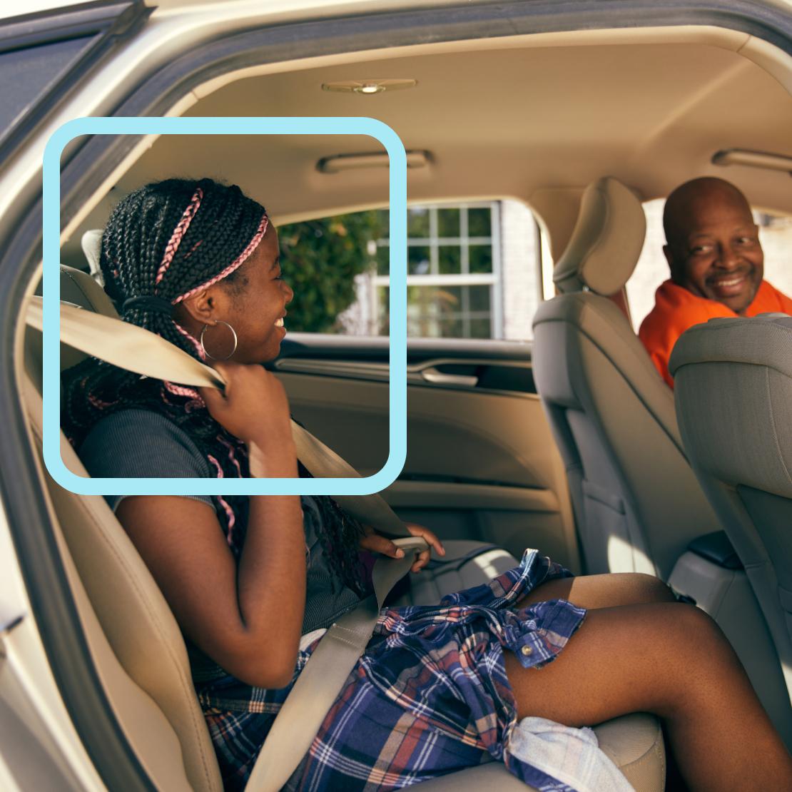 Passengers engaged in friendly conversation inside a car with beige interior, showing a warm social interaction during the ride