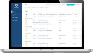 Project management software interface displayed on a MacBook showing task lists and status indicators with blue navigation menu