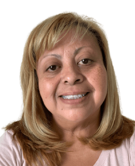 Headshot portrait of a person with blonde hair wearing a light pink top, showing a warm, genuine smile against a white background