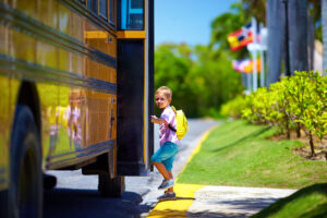 Child getting onto school bus