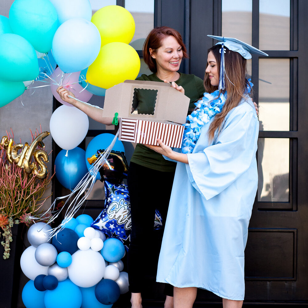 hopskipdrive_celebrate_graduation_diploma_balloons_girl